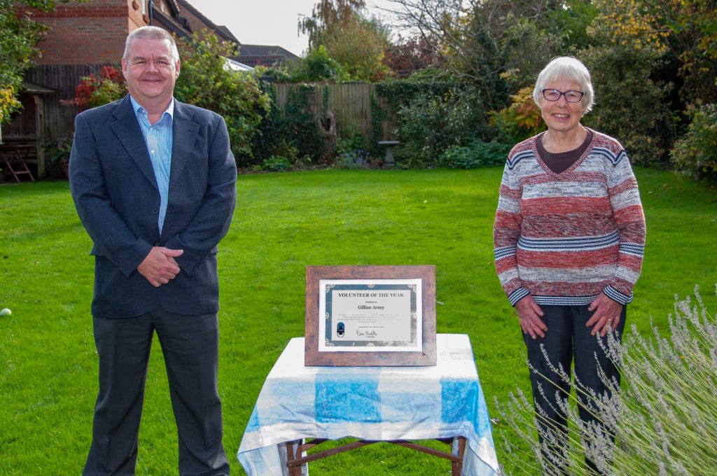 Photograph of Mrs Gillian Arney and Parish Council Chairman Dave Nicholls with Volunteer of Year framed certificate